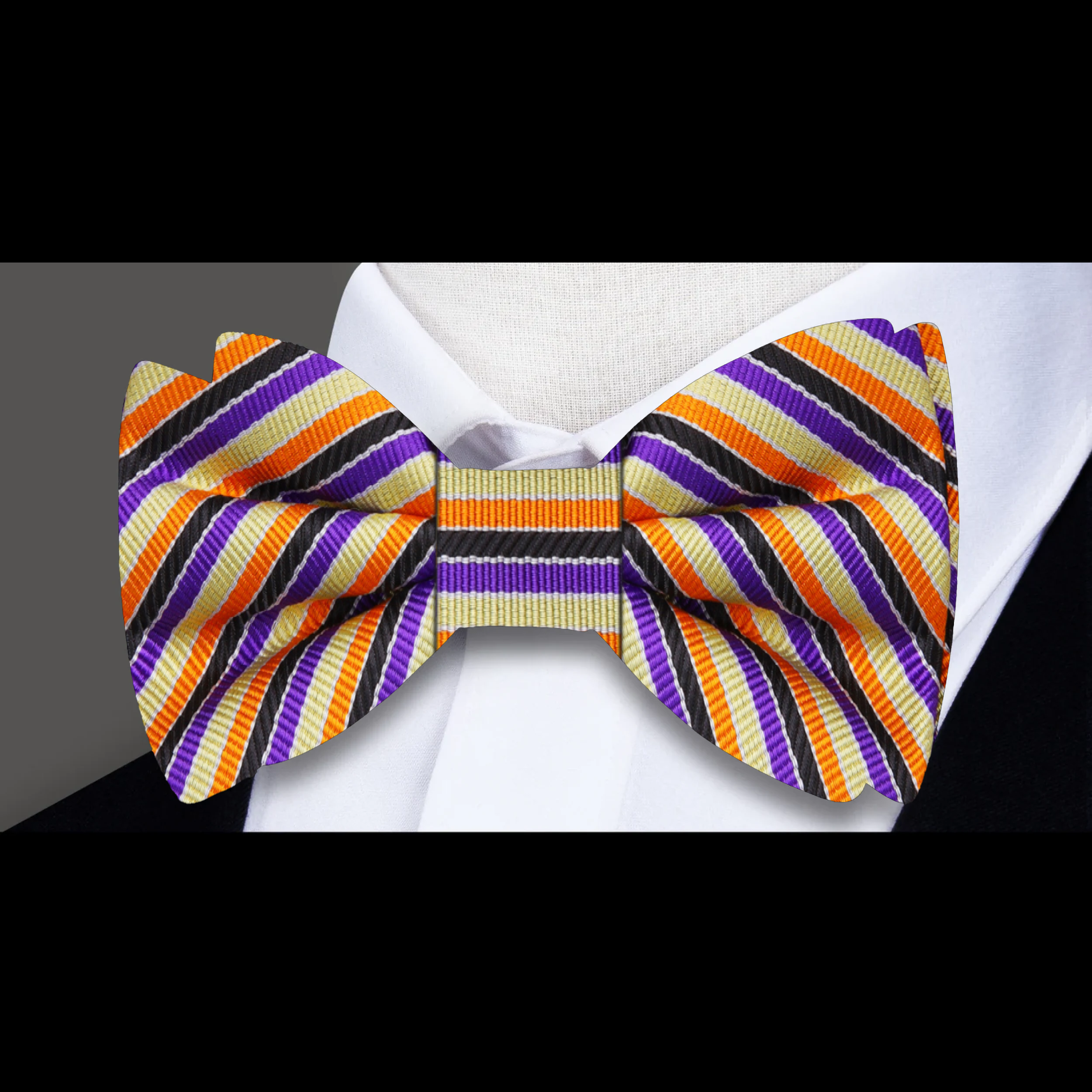 Close-up of the vibrant striped silk bow tie showcasing the bold colors and pattern.
