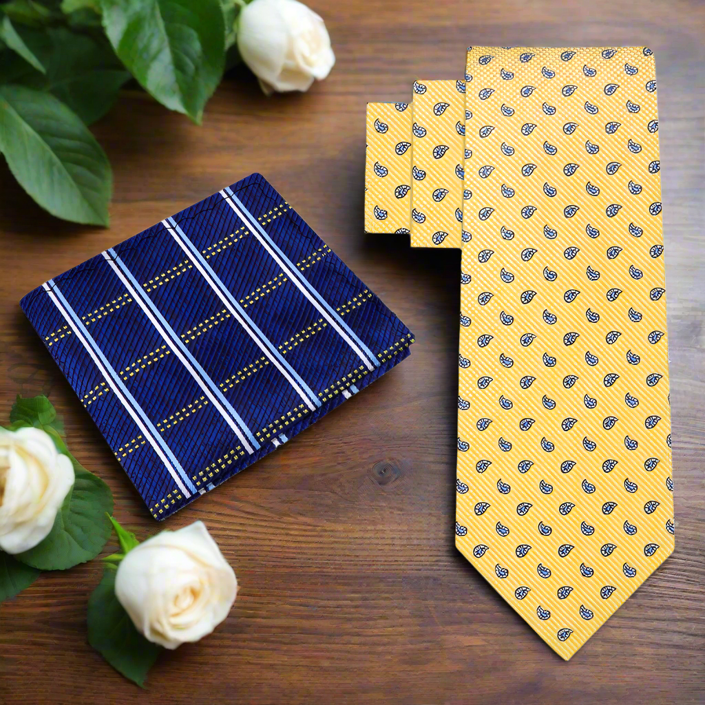 Model wearing yellow paisley silk necktie with navy suit for a wedding