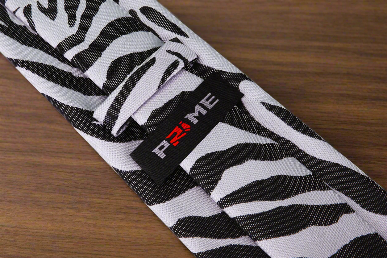 Close-up of a zebra tie with bold black and grey pattern for formal wear