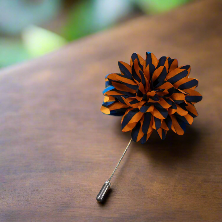 Rich yellow striped lapel pin displayed against a dark suit, enhancing its appeal.
