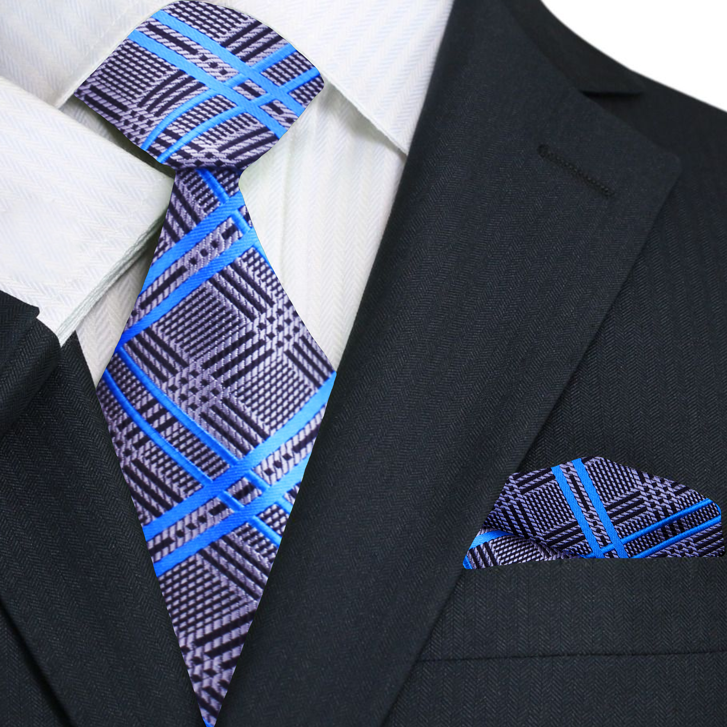 Man wearing a silver and blue plaid silk tie with a white dress shirt in a professional setting