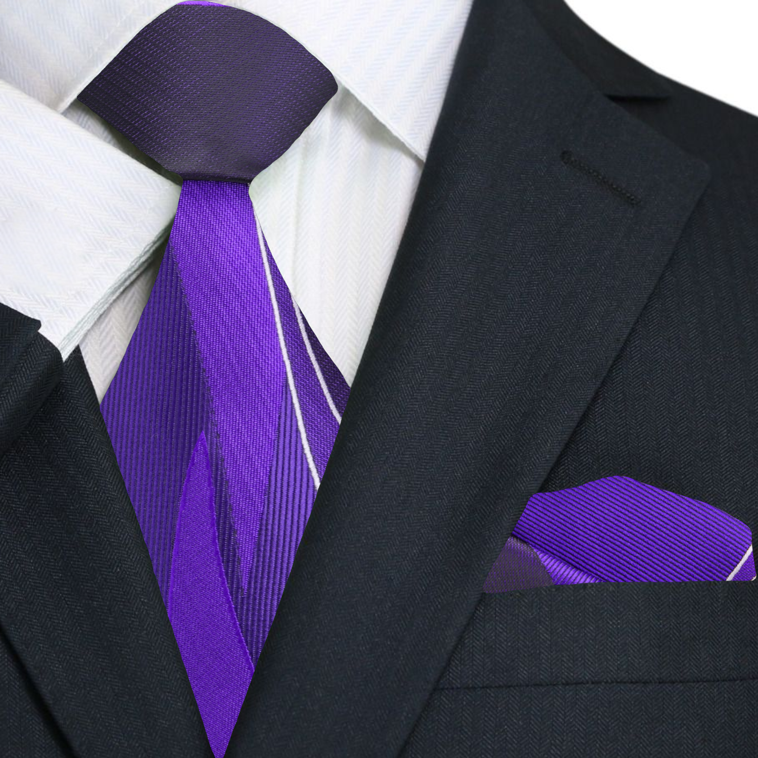 Close-up of the abstract lined pattern on the purple tie, showcasing its luxurious silk texture.