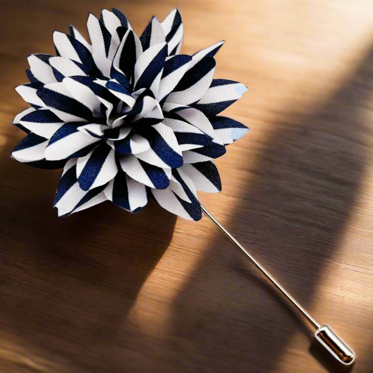 Navy blue and white striped lapel pin on a suit jacket, adding a refined touch.