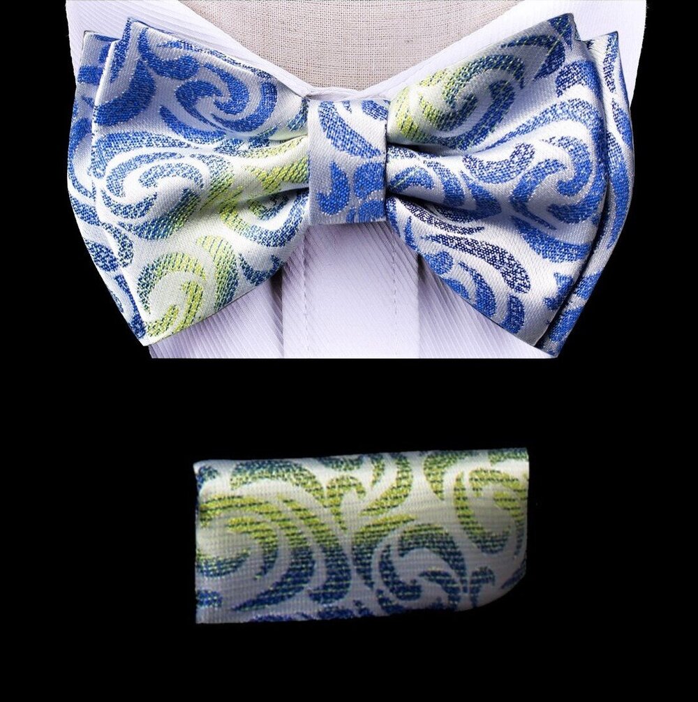 Front view of the dynamic kids bow tie and pocket square set, showcasing the green and blue abstract design.