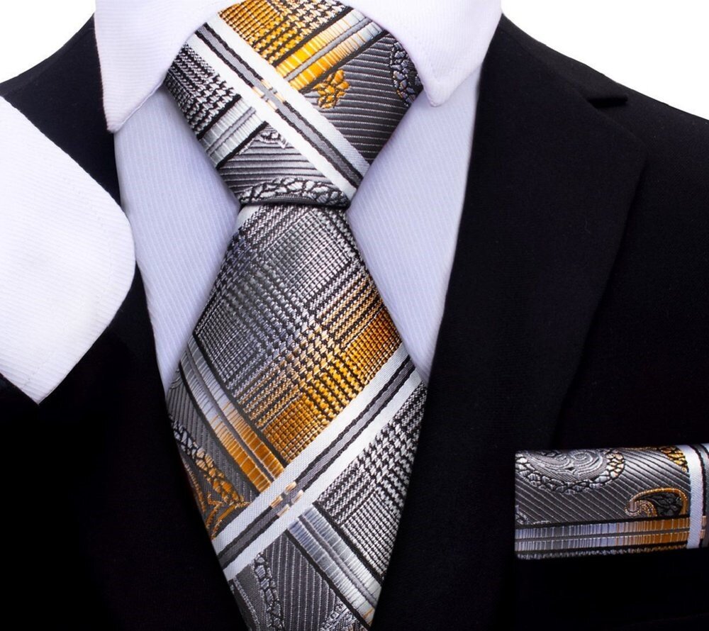 Close-up of kids silk necktie in orange paisley pattern, perfect for formal wear