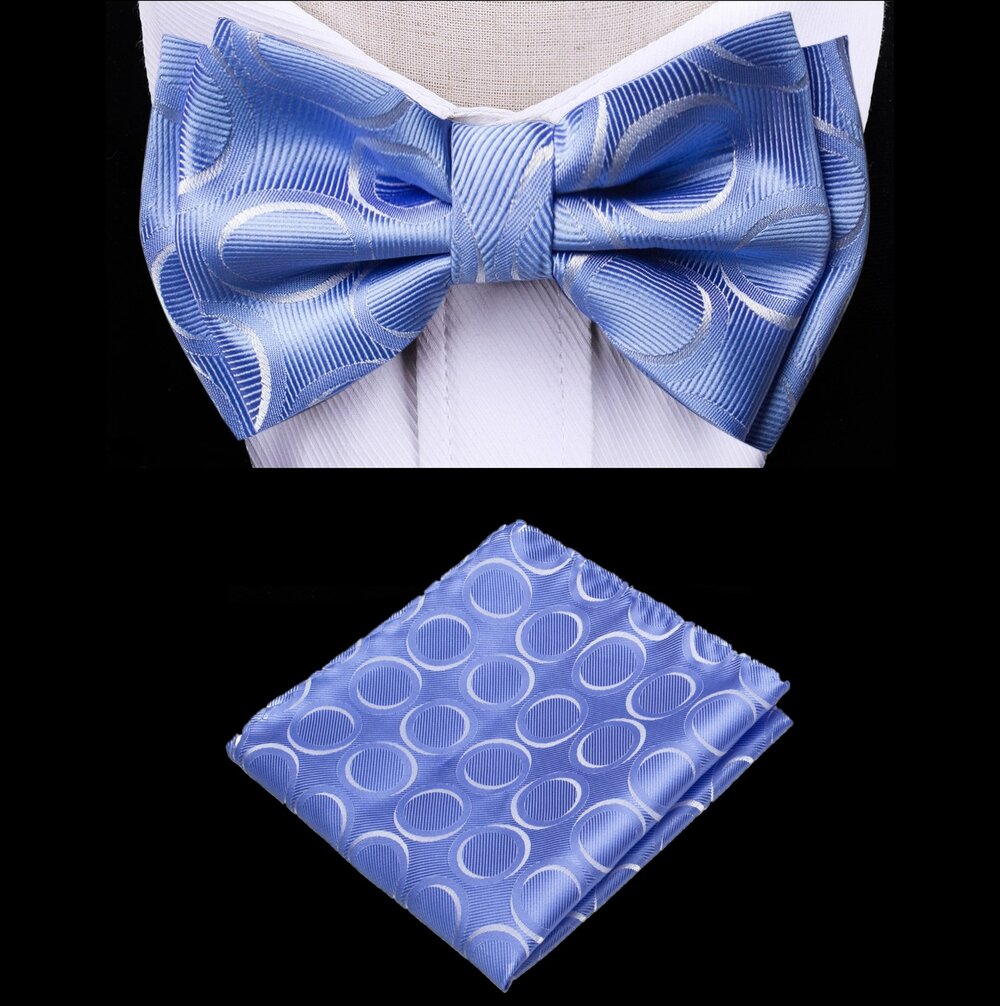 Dapper kids blue bow tie and pocket square set on a white background, showcasing the rings pattern.