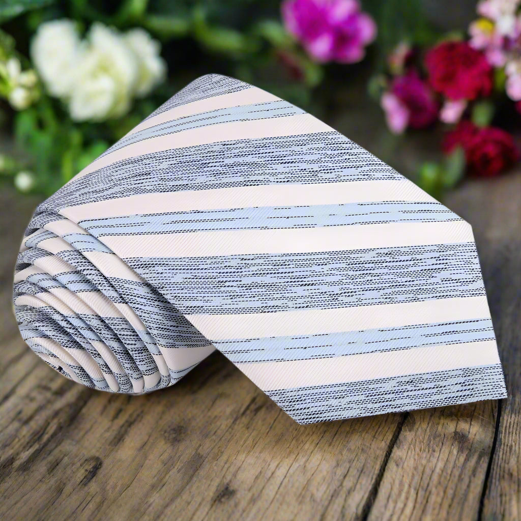 The Winthallow blue necktie displayed on a suit, illustrating its versatility for business occasions.