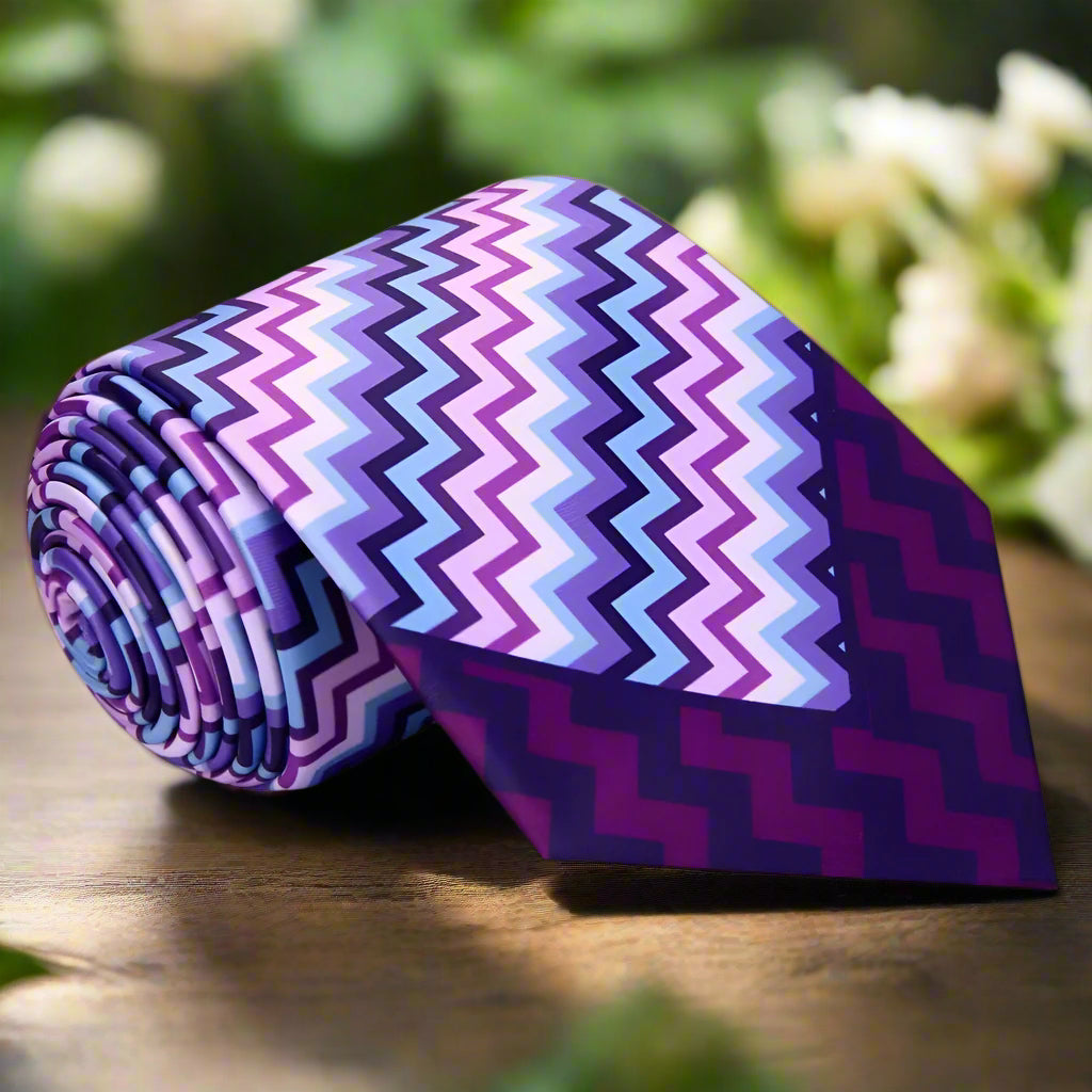 Front view of vibrant patterned silk necktie with bold blue and purple colors