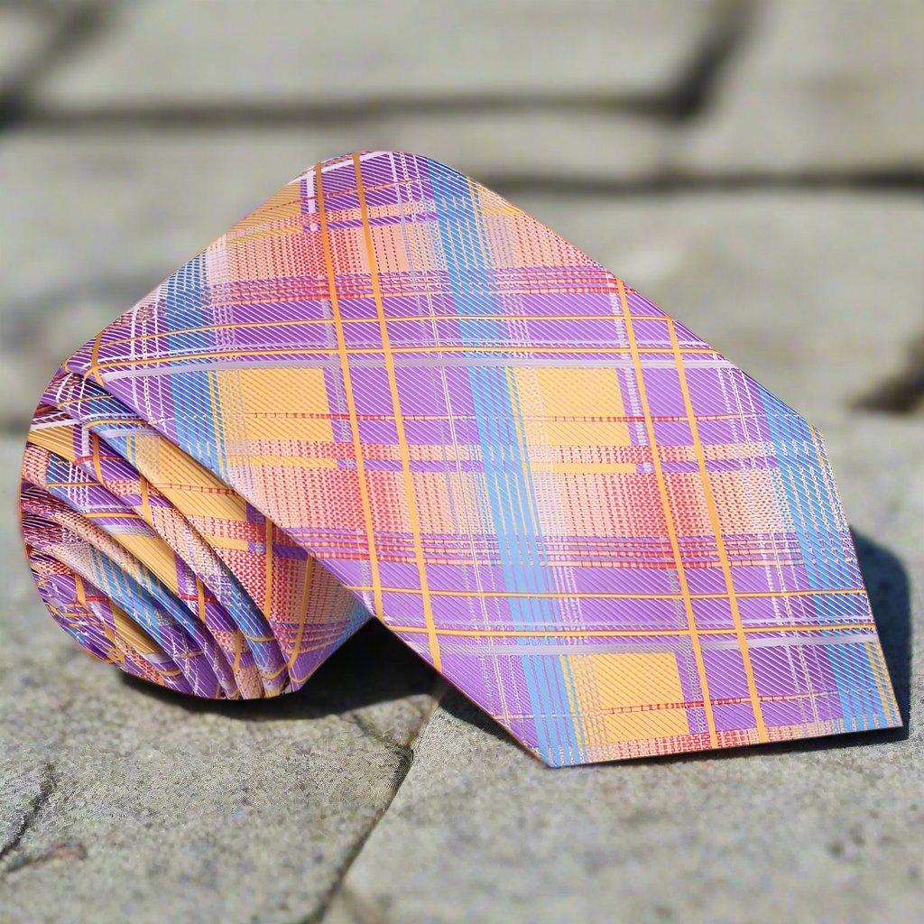 Close-up of Carlington silk plaid necktie in purple, orange, and blue showing detailed pattern
