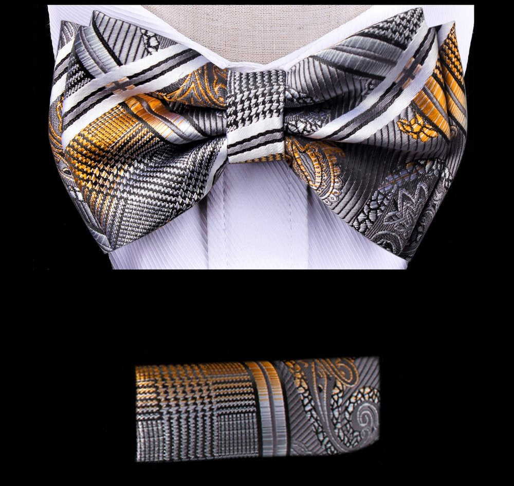 Close-up of kids bow tie with pocket square in grey and orange, showing paisley pattern