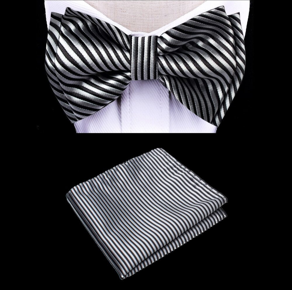 Close-up of kids platinum bow tie with silver stripe pattern on black fabric, ideal for weddings.