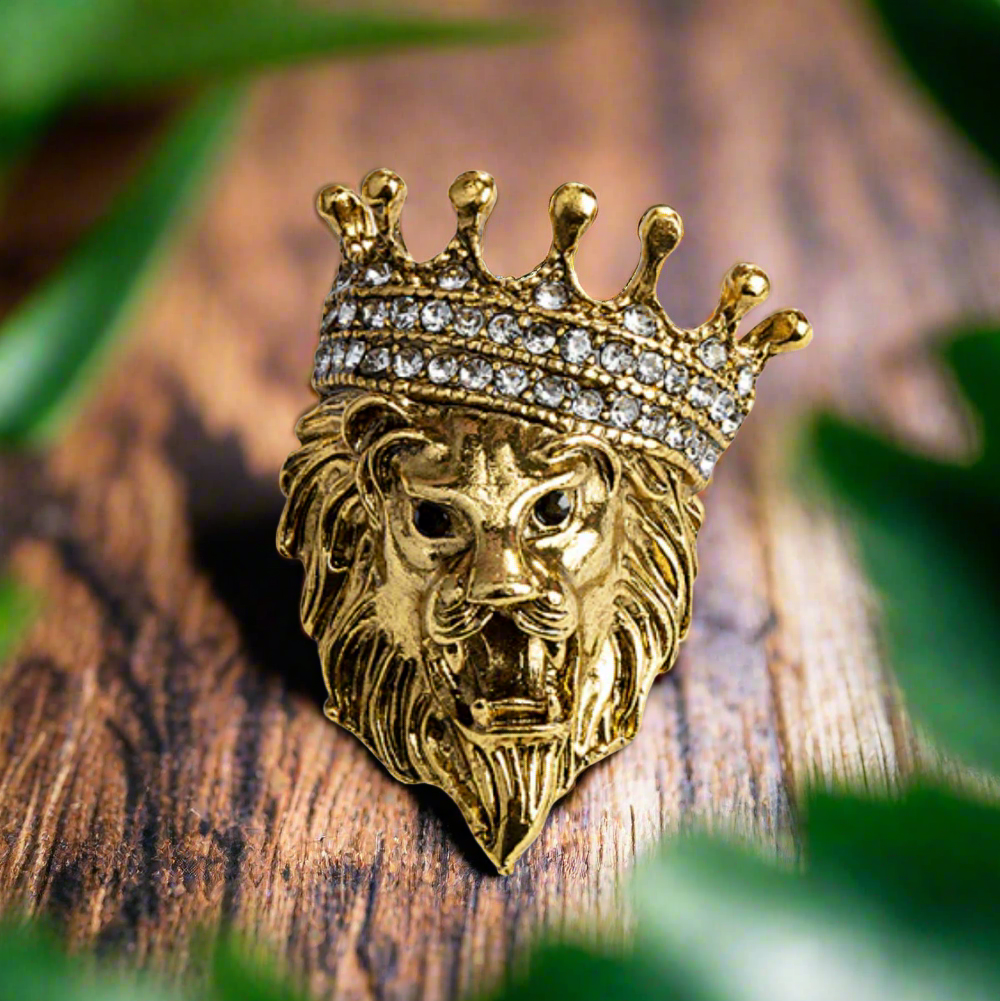 Close-up of a gemstone lion lapel pin with detailed craftsmanship