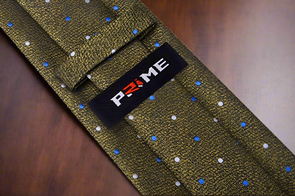 Model wearing green polka dot tie with a navy suit, showcasing a professional look.