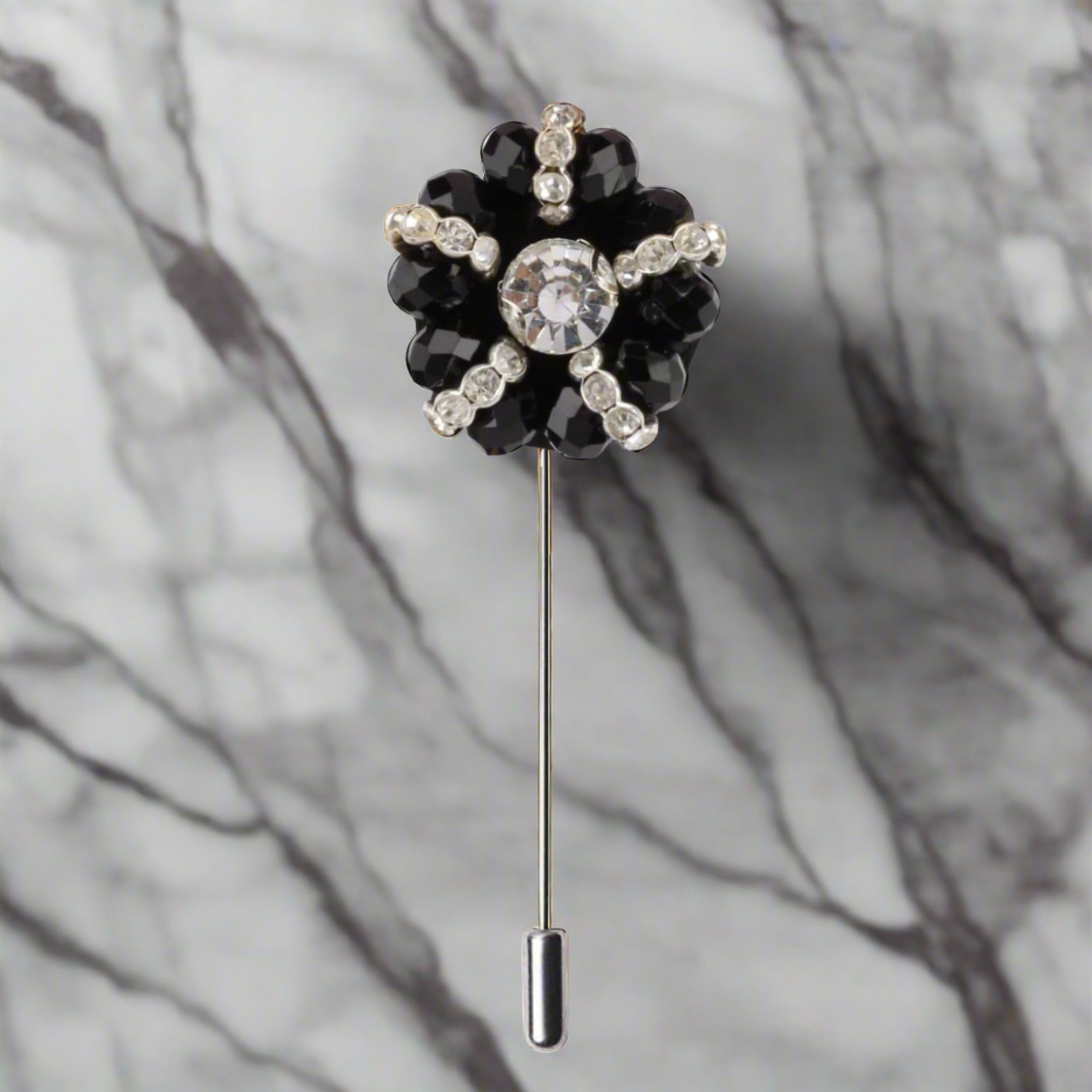 Elegant zinc alloy lapel pin with black and clear stones, viewed from the front