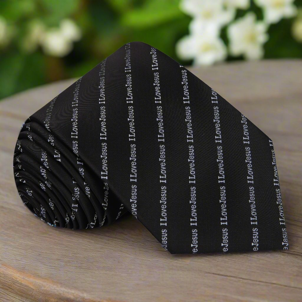 Close-up of the elegant black I Love Jesus necktie showcasing the silver script.
