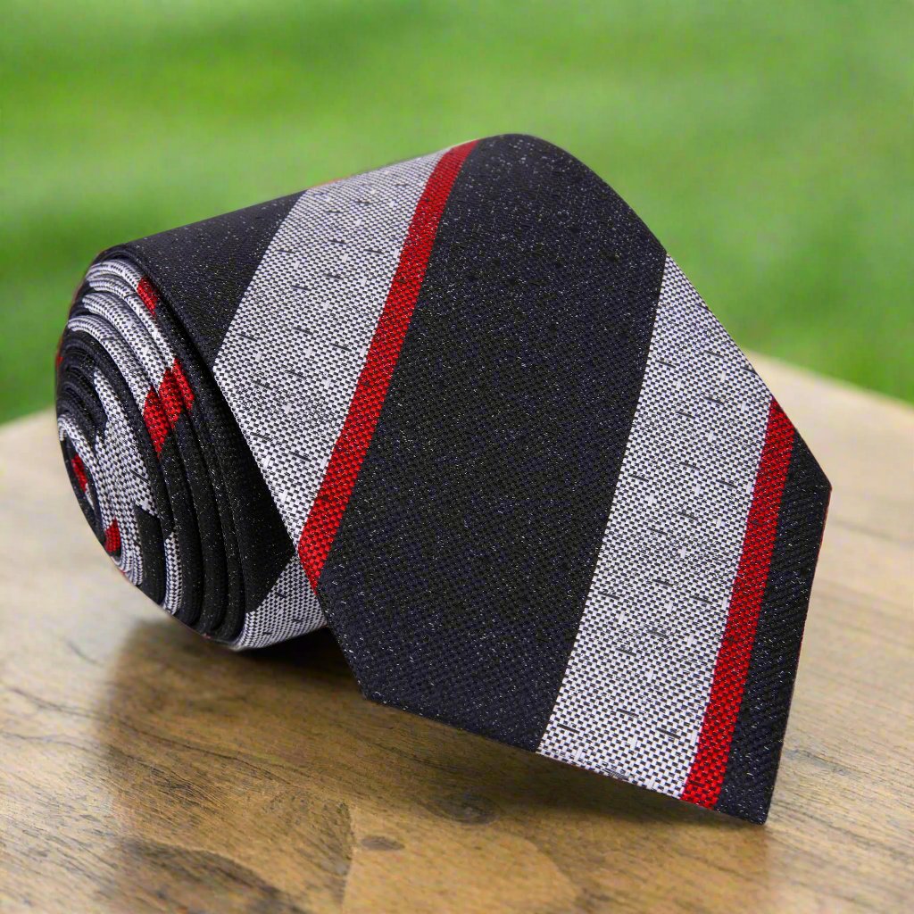 Black and red striped silk necktie styled with a dress shirt for formal occasions