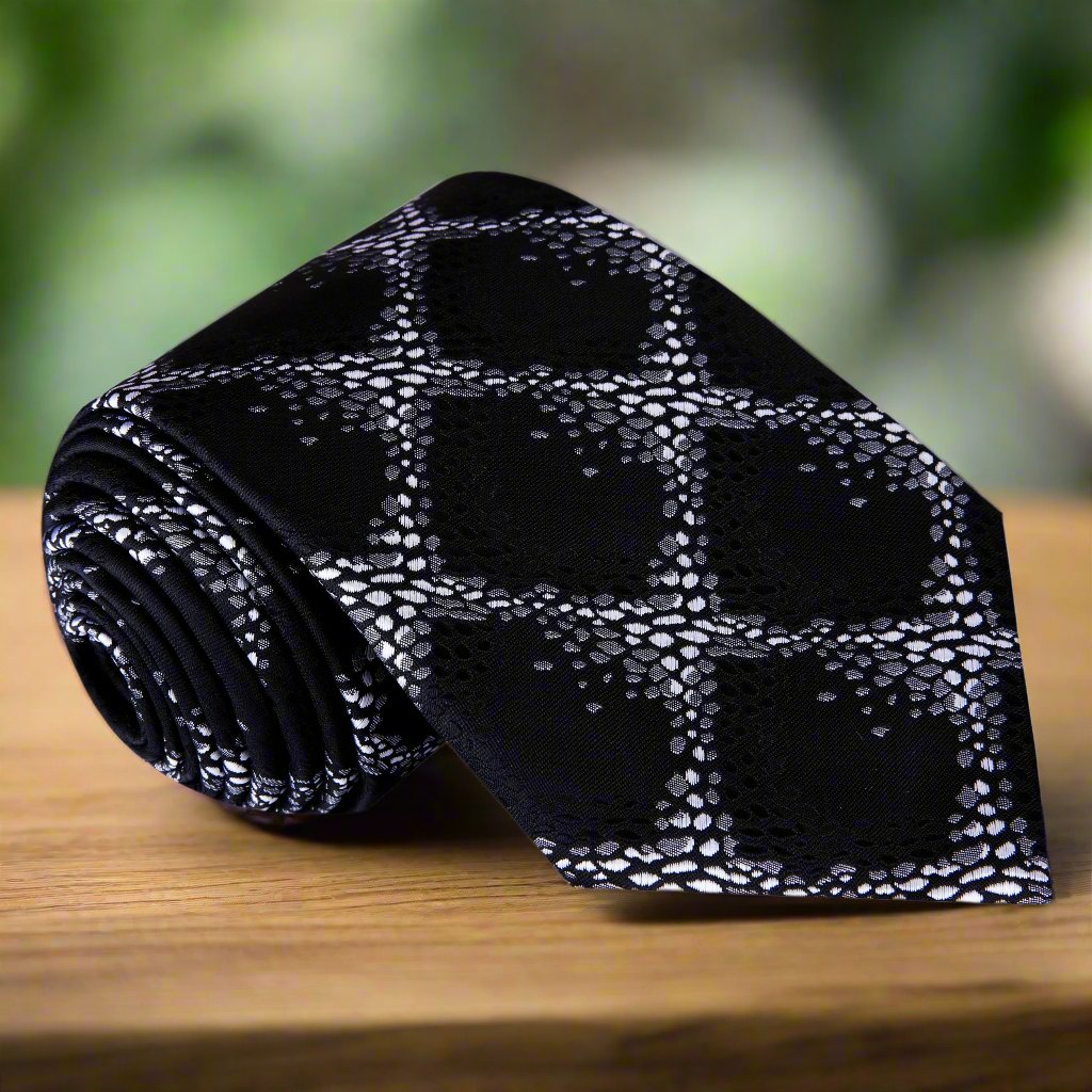 Close-up of elegant geometric brown silk necktie showcasing intricate design.