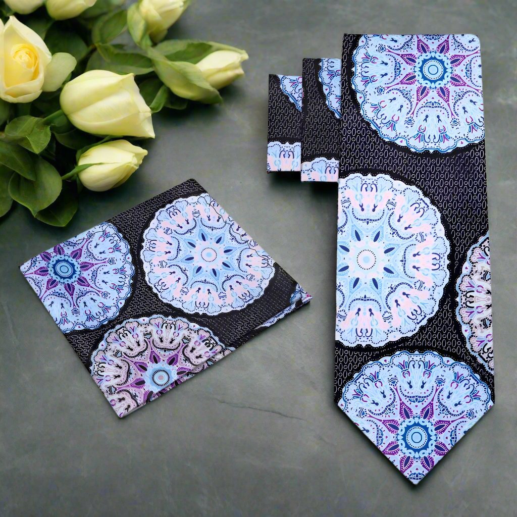 Close-up of the silk necktie showing pink kaleidoscope pattern and smooth texture