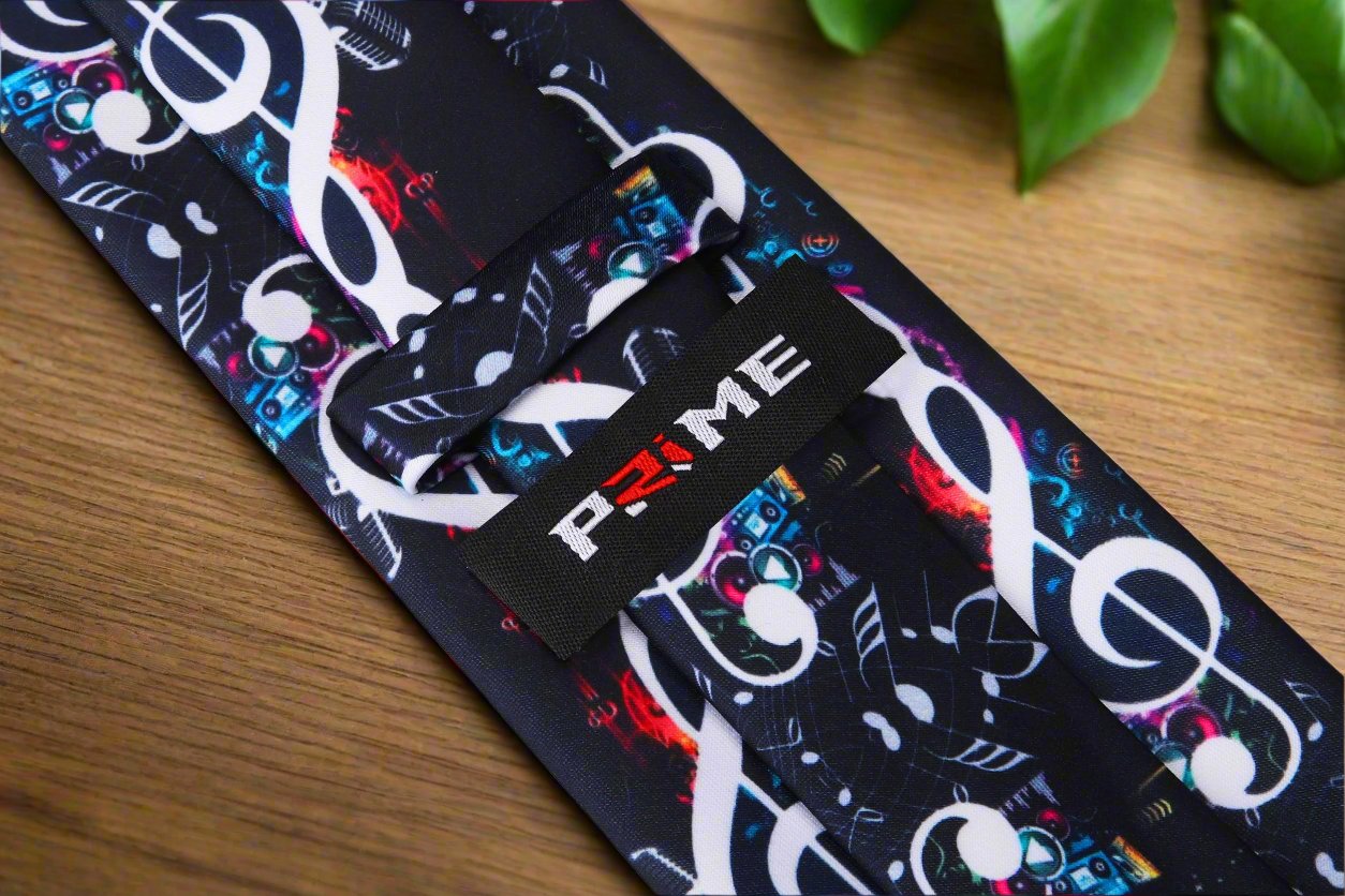 Close-up view of the black necktie featuring vibrant music notes, ideal for musicians and music lovers.