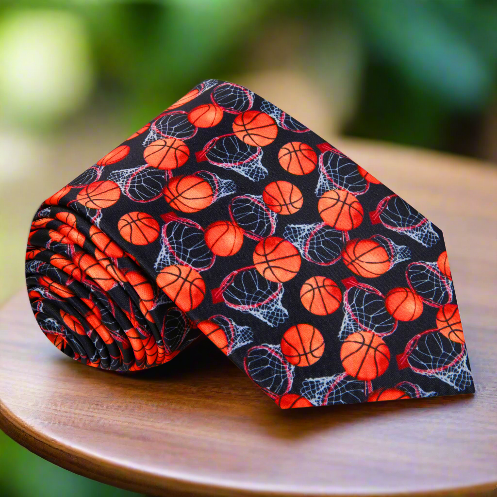 Close-up of a silk basketball tie with bold orange basketball patterns