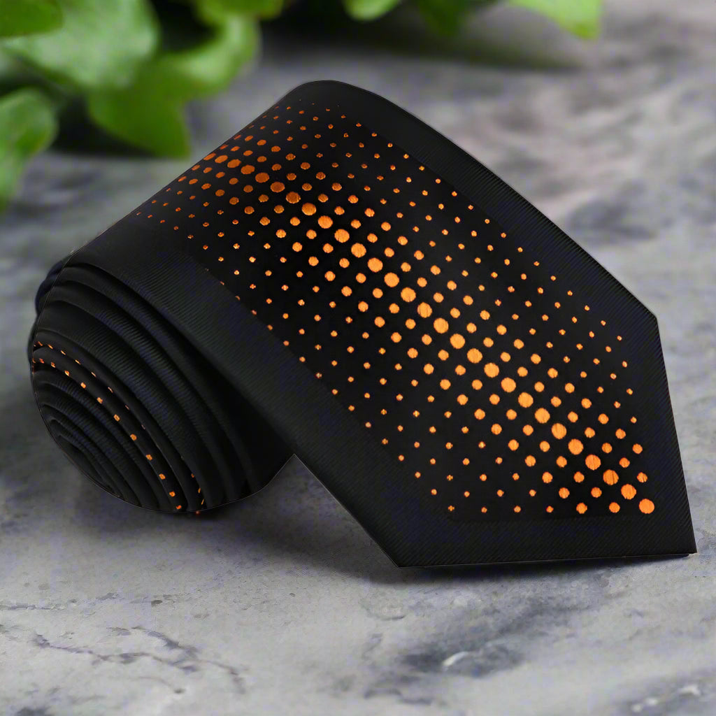 Close-up of a black silk dotted tie with silver accents, perfect for weddings and formal events