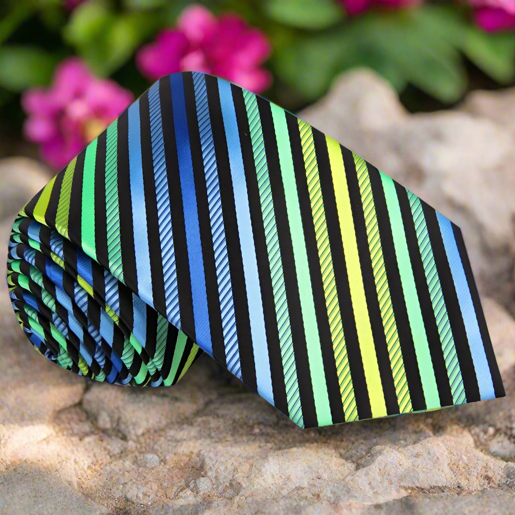 Close-up of the Isle of Skye Stripe Silk Tie showing vivid green, yellow, blue, and black stripes, ideal for a formal look.