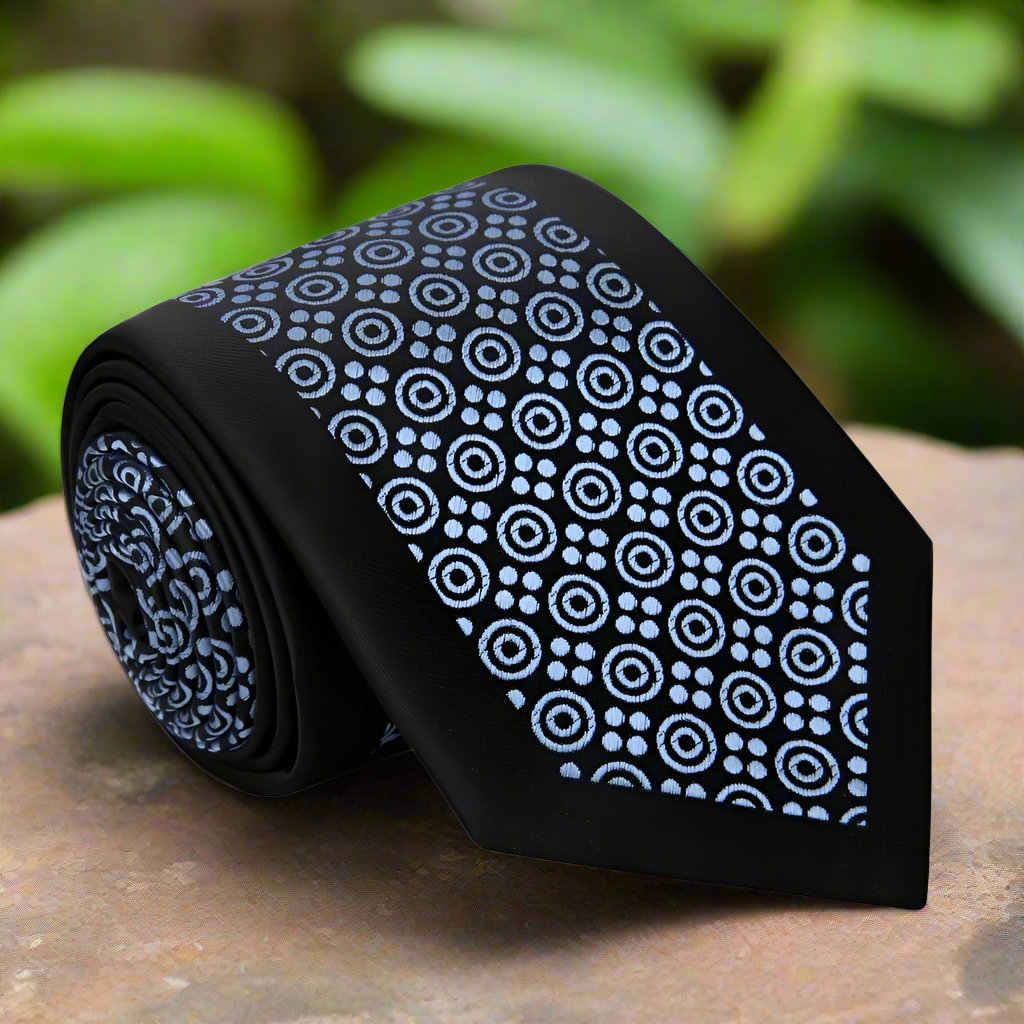 Close-up of men's silk necktie with blue circles pattern, perfect for formal events