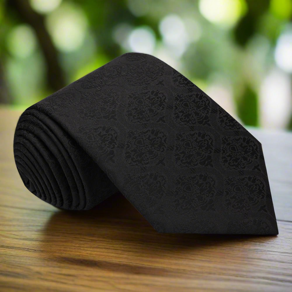 Close-up of chocolate brown silk necktie showing intricate weave and sheen