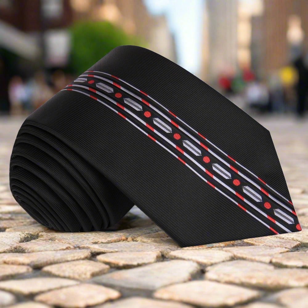 Close-up of a silk necktie with links pattern in black, red, and grey for formal wear