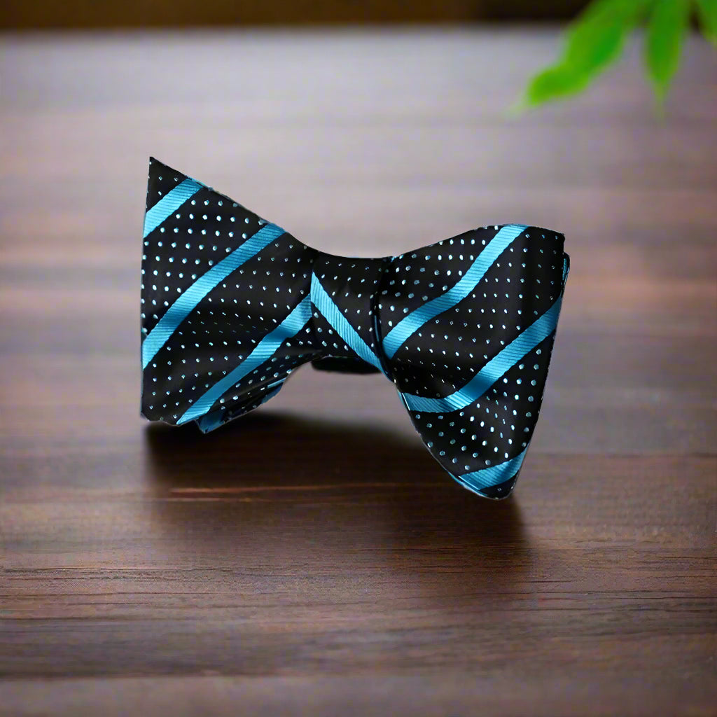 Elegant bow tie paired with a charcoal grey suit, perfect for formal events.
