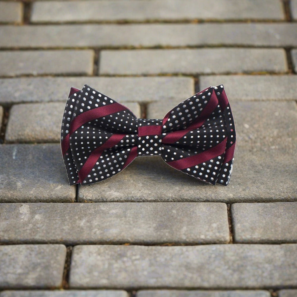 Close-up of silk bow tie showcasing intricate stripes and polka dots.