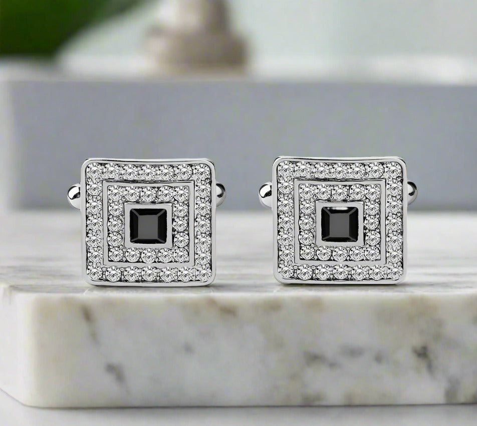 Close-up of stylish mens cufflinks featuring black and clear stones
