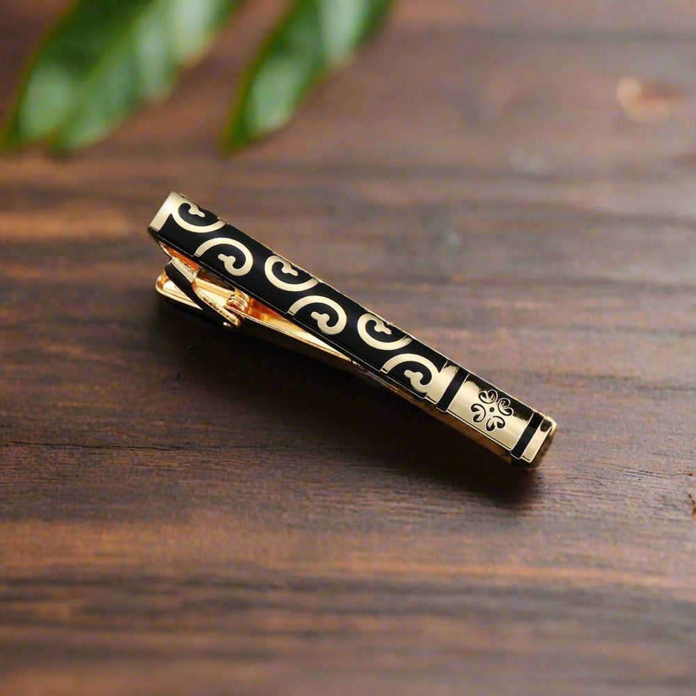 Zebra pattern tie bar with stone accents, ideal for a unique and stylish look.