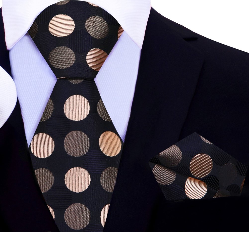 Man wearing a colorful polka dot tie at a wedding, displaying a stylish and confident look.