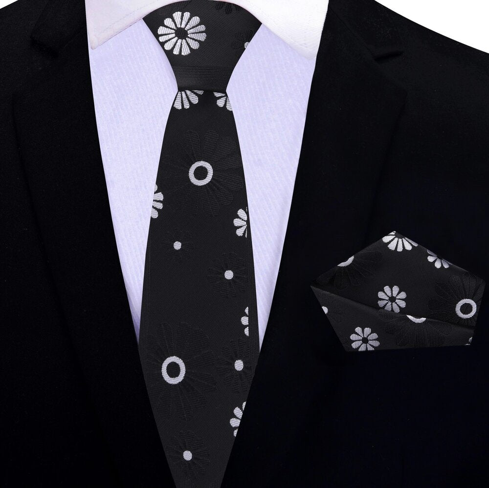 Elegant cactus flower necktie worn with a charcoal grey suit for a polished appearance.