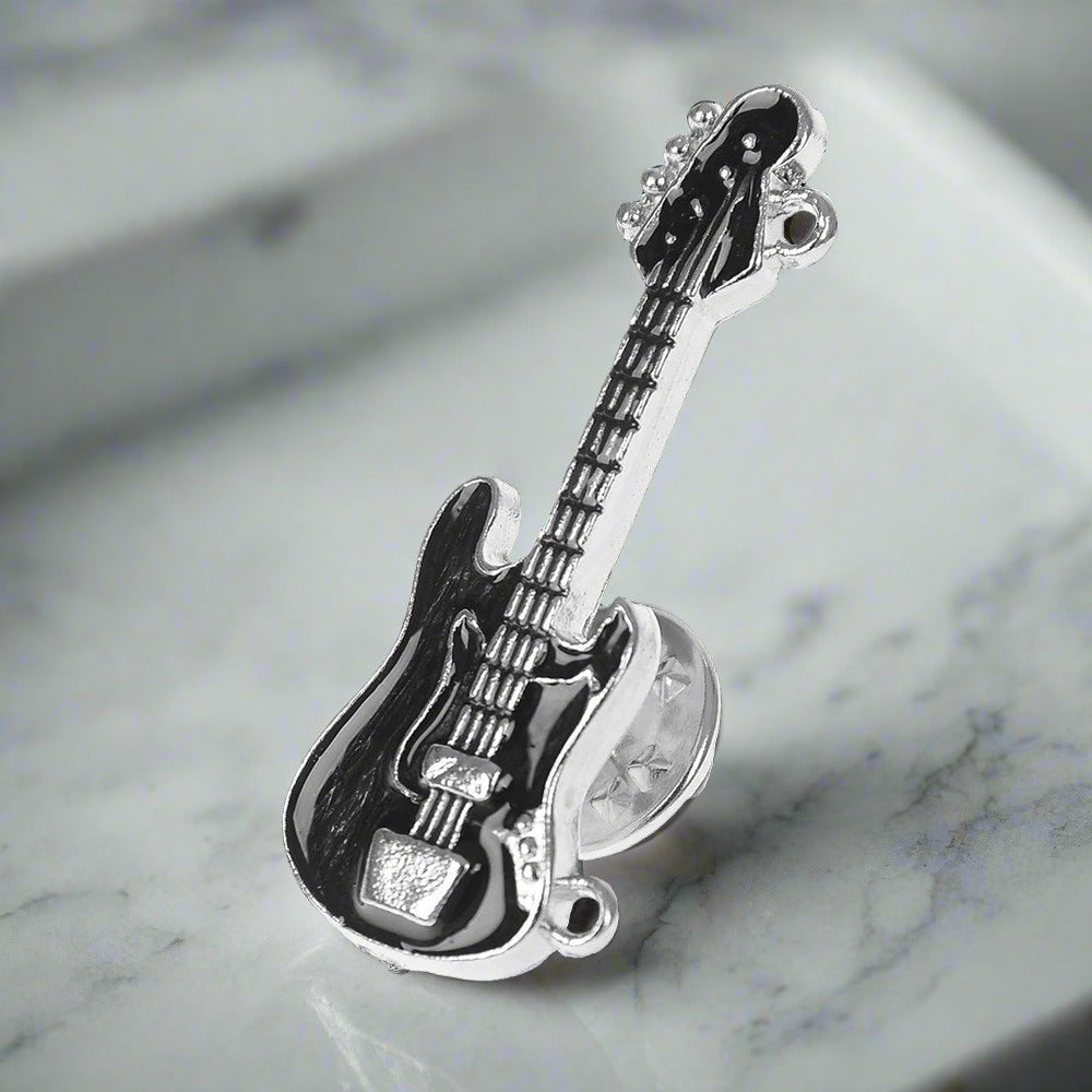 Collection of different guitar lapel pins in various colors