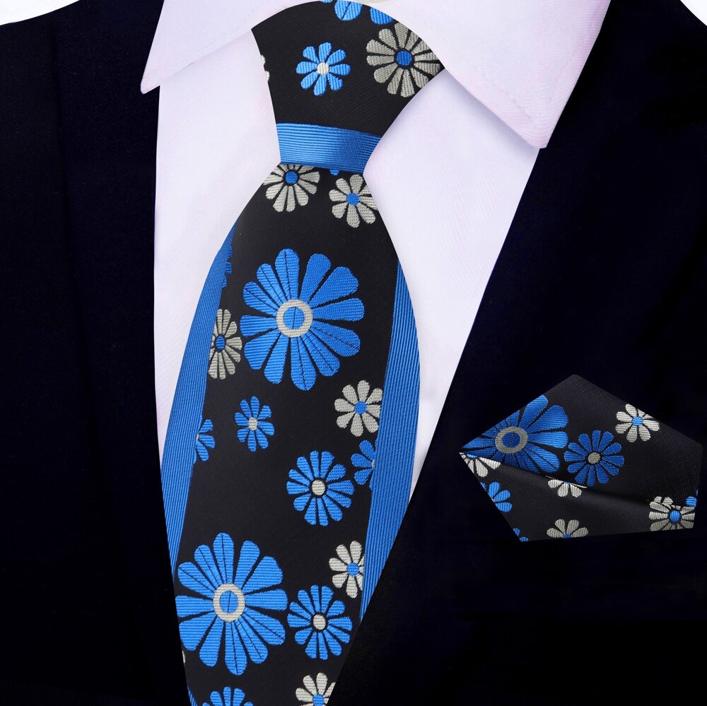 Elegant cactus flower necktie worn with a charcoal grey suit for a polished appearance.