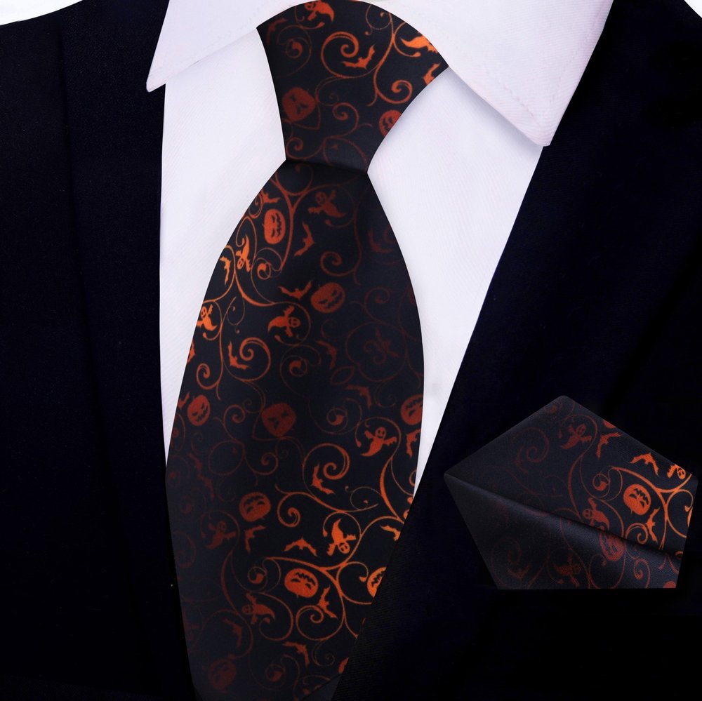 Close-up of the Halloween themed silk tie showcasing intricate patterns of bats and vines.