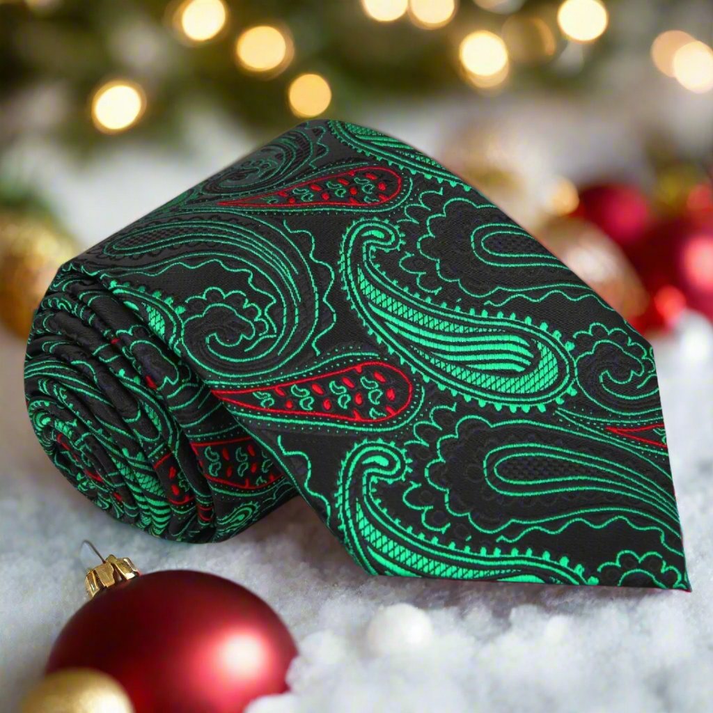 Close-up of stylish paisley Christmas necktie in black with red and green accents