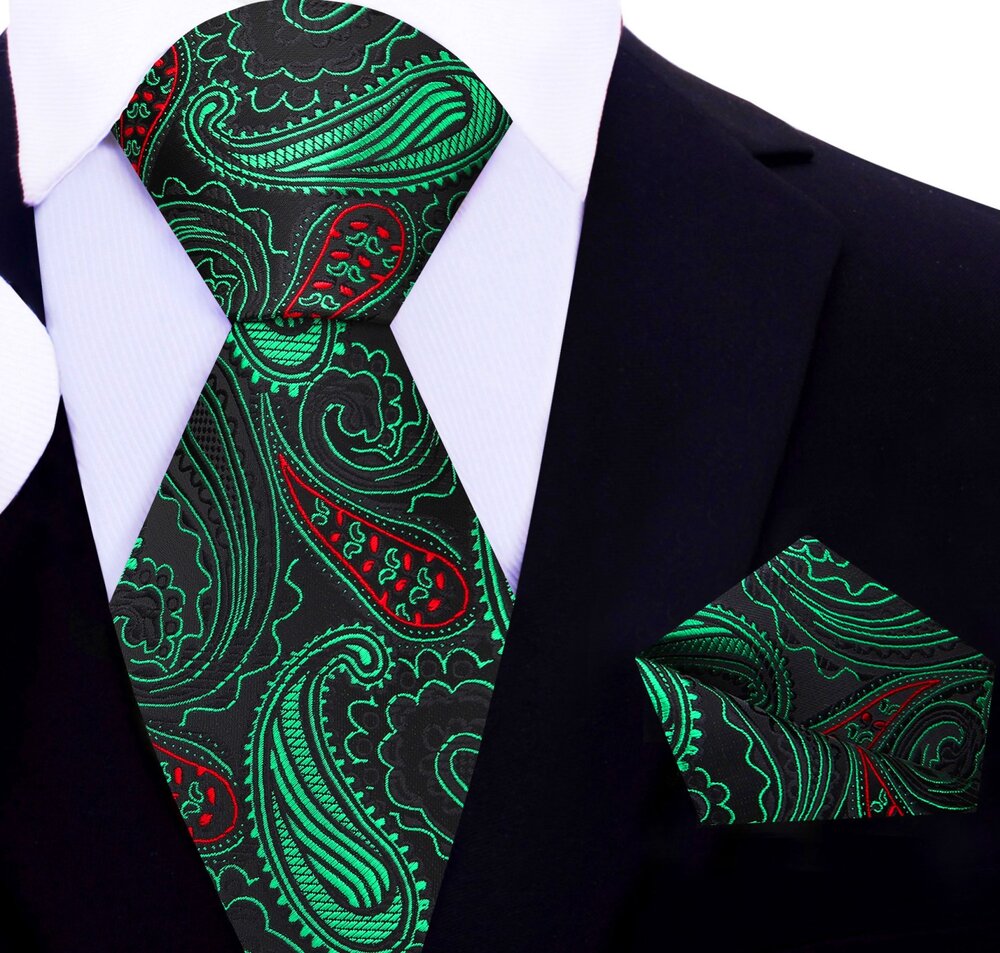 Close-up of stylish paisley Christmas necktie in black with red and green accents