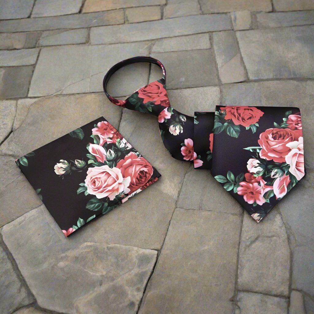 Close-up of the floral print necktie, highlighting the vibrant pink roses against a rainy day gray background.