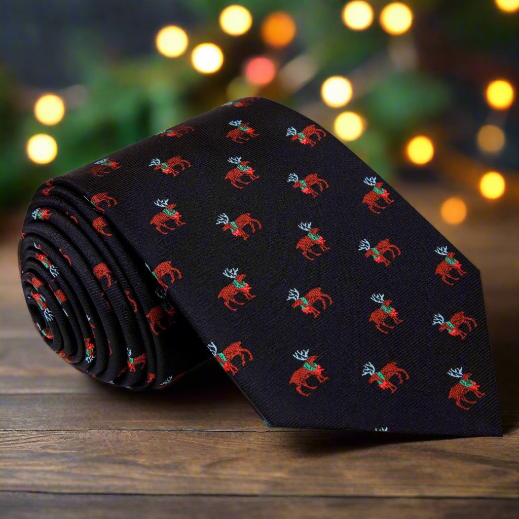 Close-up of festive reindeer and wreath necktie styled with a white shirt