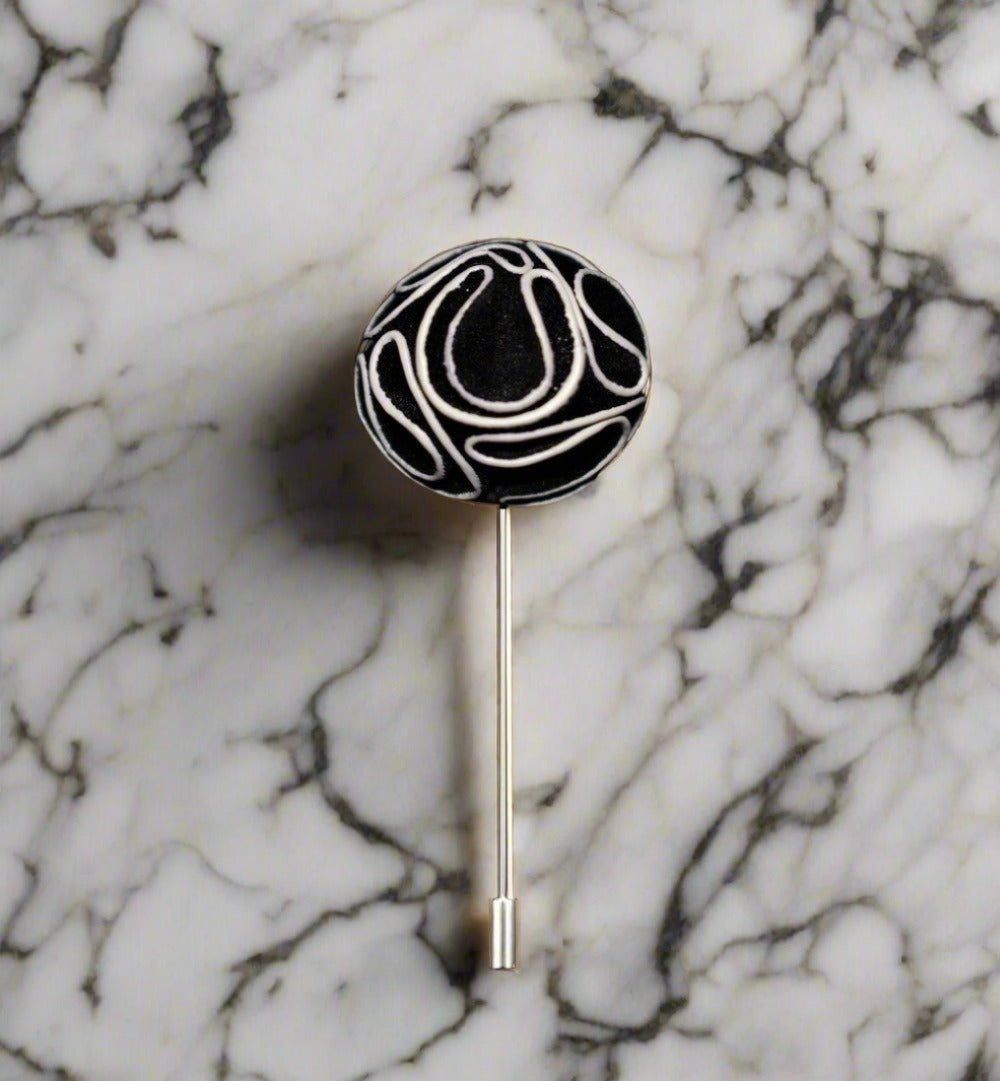 Variety of elegant custom flower lapel pins in multiple colors.