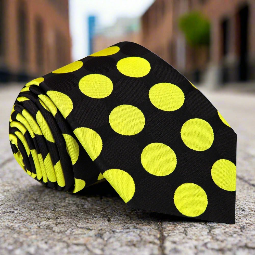 Close-up of the vibrant polka dot silk necktie, emphasizing the texture and quality of the fabric.