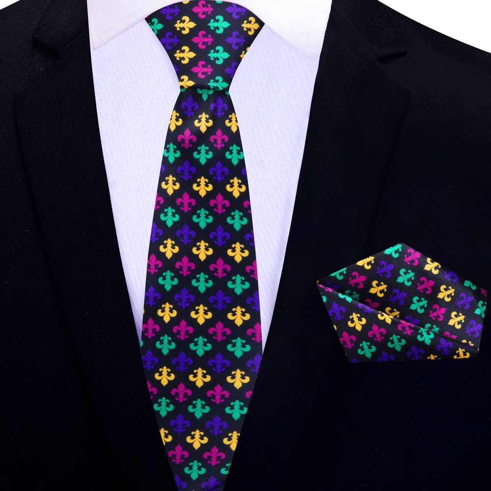 Close-up of the vibrant fleur de lis silk necktie with a bold black background, ideal for festive occasions.
