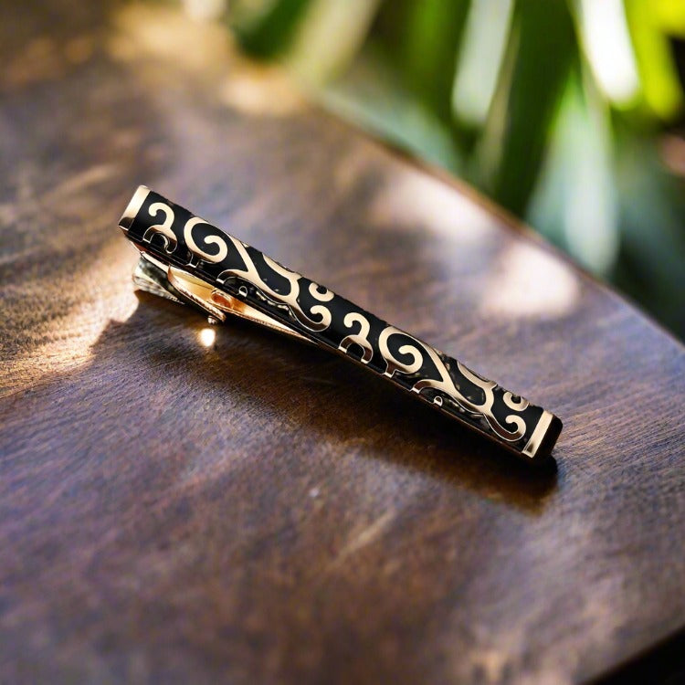 Zebra pattern tie bar with stone accents, ideal for a unique and stylish look.