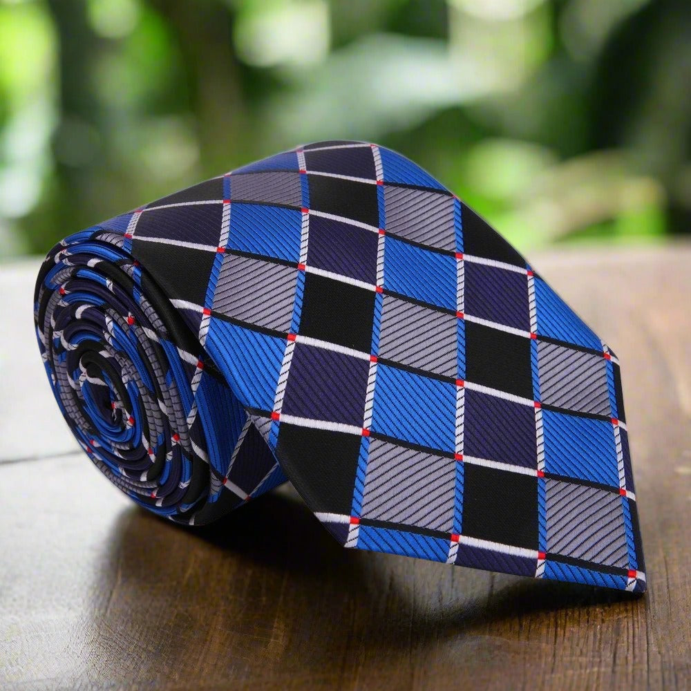 Close-up view of the elegant brown and gold geometric silk necktie, showcasing its intricate design and luxurious fabric.