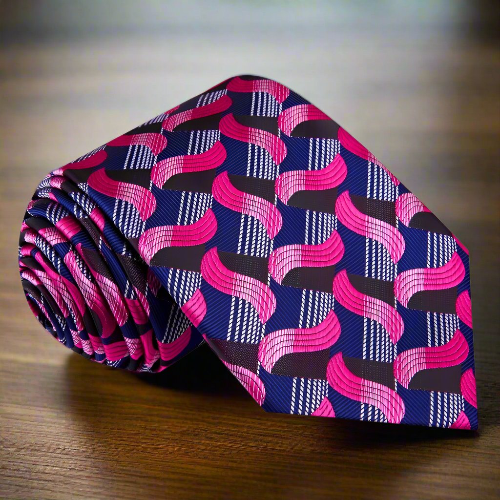 Close-up of the vibrant blue and pink abstract silk necktie showcasing its unique design.