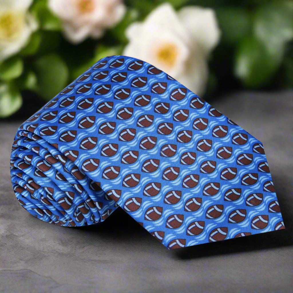 Blue necktie featuring playful brown footballs, perfect for sports events.