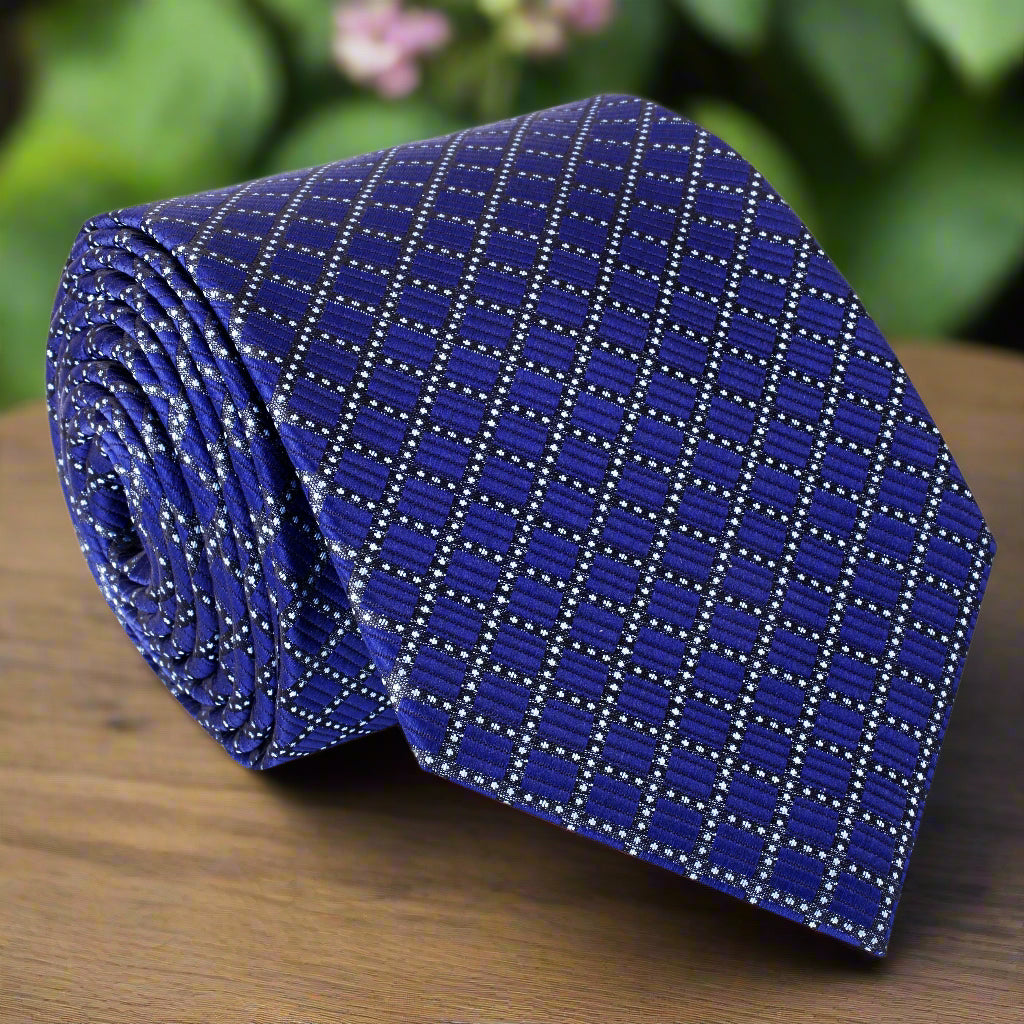 Front view of dark blue silk necktie with geometric check pattern, folded neatly
